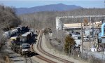 NS yard job E19 shuffles interchange cars in the yard next to CSX's James River Line.  U.S. Pipe facility is to the right.  Tobacco Row Mountain looms in the background.